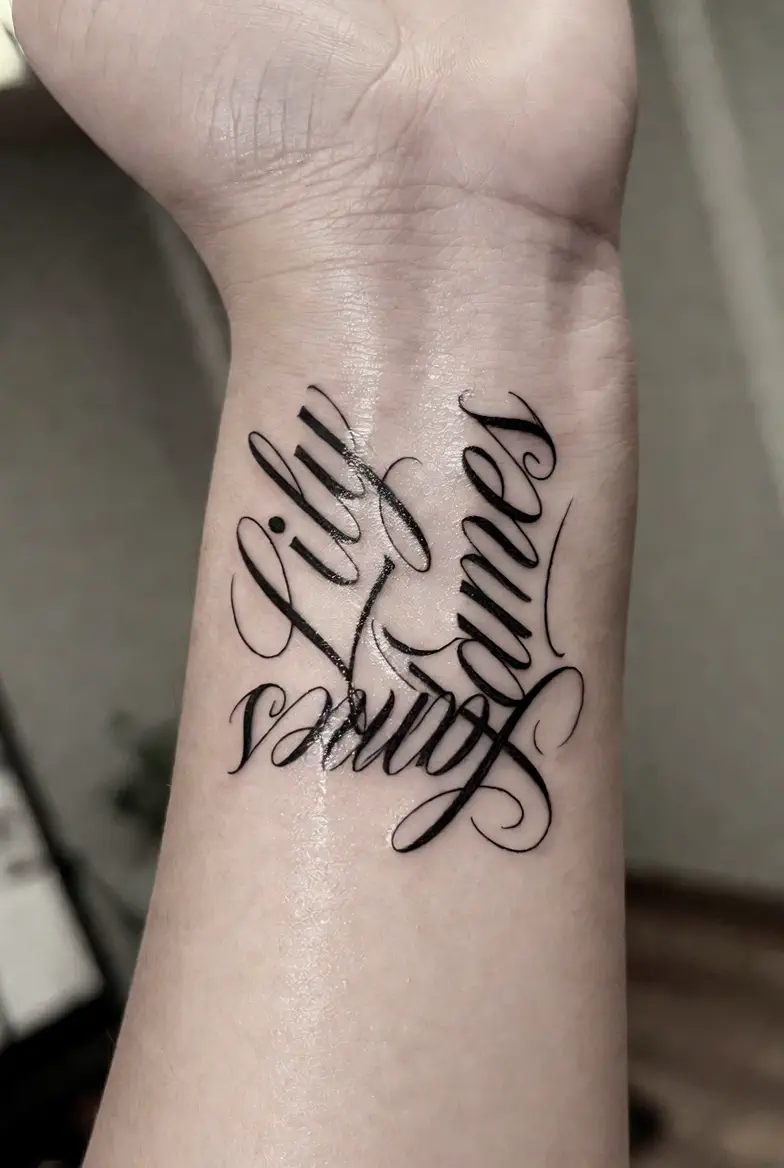 Fine-line couple wrist tattoo concept for Aria and Miles in black ink
